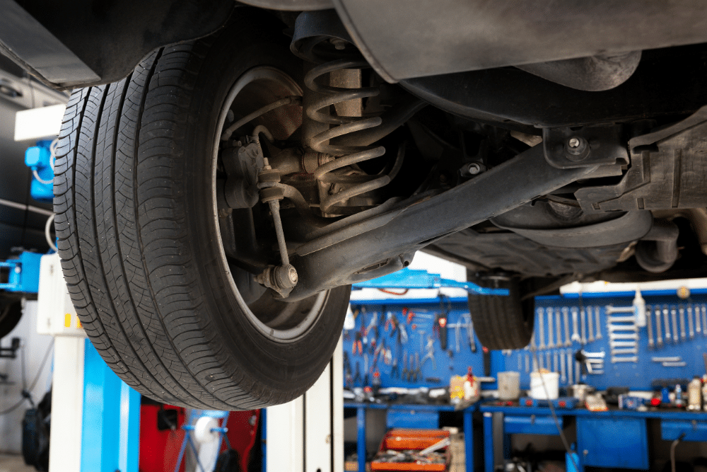 Suspension Repair in Tecumseh, OK at Miller Brothers Automotive. Close up view of a lifted vehicle highlighting suspension