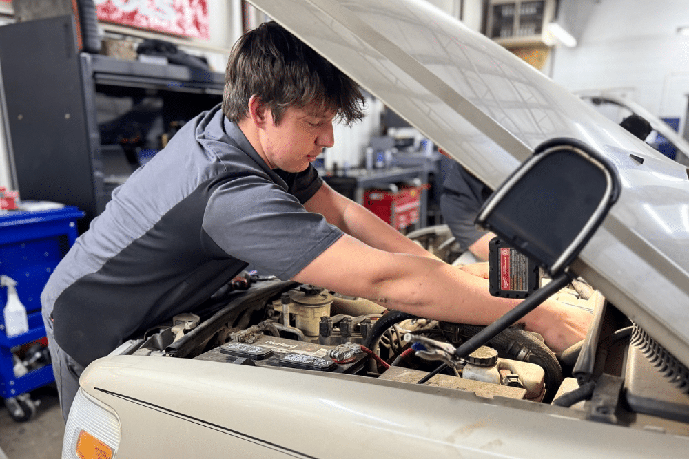 Engine Repair, Auto Repair & Mechanic Services for Seminole, OK At Miller Brothers Automotive. Mechanic working under the hood of a car engine.